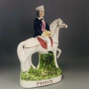 An antique Staffordshire right facing Flat Back man on horseback titled PRINCE