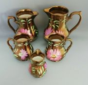 A Set of 5 Vintage Wade Hand Painted Pink Purple Floral Copper Lustre Jugs