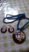 Necklace and earrings with indian God design. Blue