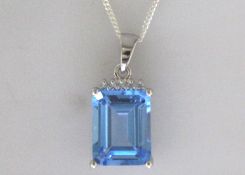 9k White Gold Diamond And Blue Topaz Pendant 0.01 Carats
