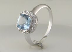 9k White Gold Diamond And Blue Topaz Ring 0.10 Carats