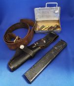 Group of military items. Pistol belt, holster, magazine, training rounds.
