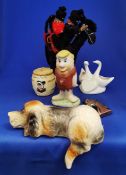 Group of novelty items including lazy dog, Barney Rubble, Welsh lady honey pot.