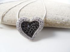 Heart shaped silver pendant on chain