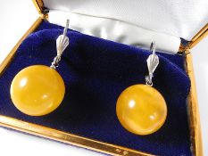 Yolk amber ball hinged earrings