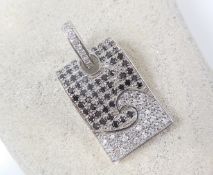 Silver pendant set with black and white stones
