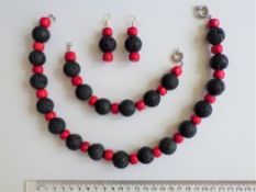 A Red Coral And Hawaiian Lava Necklace, Bracelet And Earrings Set.