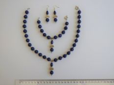 A Lapis Lazuli Necklace, Bracelet And Earrings Set