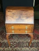 A vintage drop front bureau.