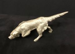 A Vintage cast white coloured metal hunting dog.