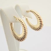 Earring. In 14K Yellow Gold