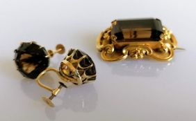 A Victorian smoky topaz brooch/pendant, the emerald-cut stone approximately 21mm x 15mm with c-