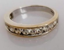 An 18ct white gold half-hoop diamond eternity ring with twelve graduated stones ranging from 0.05 to
