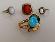 A yellow gold opal ring in the Grecian style, size P, stamped 9kt, 4.2g and three silver gem-set