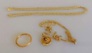 A 22ct yellow gold wedding band, size M 1/2, 2.62g; a 9ct yellow gold St. Christopher pendant and