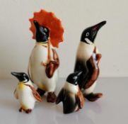 A Beswick penguin family of four, without damage or repair