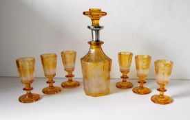 A 19th century Bohemian amber glass decanter with silver collar, 20.5 cm, etched glade scene,
