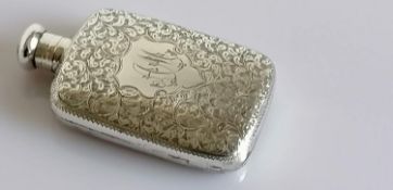 A late Victorian silver hip flask with seaweed etched decoration, filled cartouche, screw cap (