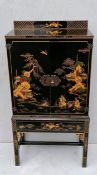 A Meiji period lacquered cabinet with Shibayama inlaid decoration, twin doors revealing a shelved