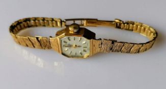 A mid-century ladies Rotary manual dress watch with baton markers, hallmarked 9ct gold case and