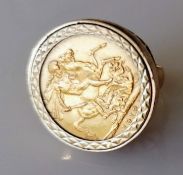 A George V gold full-sovereign ring on a 9ct gold mount, hallmarked, size K, dated 1913, Melbourne