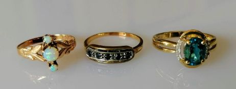 Three gem-set, 9, 10 and 14ct gold rings, sizes L, M, O, stamped, 5.7g