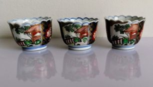 A set of three Japanese Imari sake or tea bowls with underglaze blue and overglaze polychrome