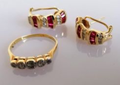 A pair of garnet and diamond earrings, stamped 14k and a 5-stone illusion-set diamond ring, size P