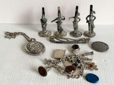 A set of four Edwardian Burmese silver place holders, each 7 cm H; an Islamic silver bracelet,