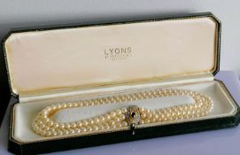 An Art Deco-style three-row cultured pearl necklet on an 18ct white and yellow gold lozenge-shape