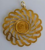 A Victorian gold full-sovereign, 1888, on a pierced 9ct gold mount, diameter 7 cm, hallmarked, 18.