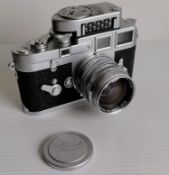 A cased Leica M3 camera, chrome, serial no. 914996, 1957, shutter working, with a Leitz Wetzlar