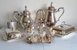 An assortment of silver plate to include a four-piece tea and coffee service, two food warmers, an