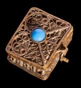 KORAN : A late 19th Century miniature Koran in gilt filigree case set turquoise, size 2.5 x 1.5cm.
