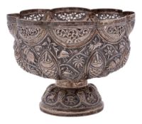 An Indian silver bowl: of lobed circular outline, with embossed decoration of figures,