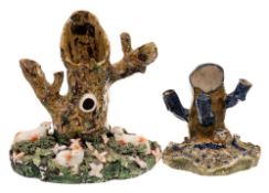 A large early 19th century Staffordshire sheep and tree trunk spill group and one similar: the