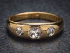 A gentleman's 18ct gold and diamond three-stone gypsy-set ring: set with round old,