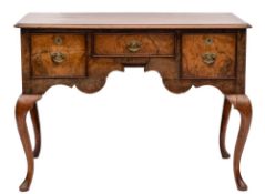 A walnut lowboy in the early 18th Century taste:,