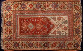 A Feraghan runner:, the indigo field with serrated cruciform and stellar medallions,