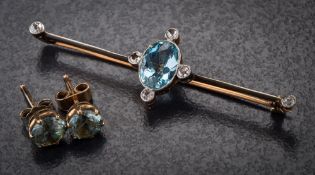 An aquamarine and diamond-set bar brooch: set with a single oval aquamarine and six round old,