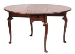 A George II mahogany oval drop leaf dining table:, with a hinged top,