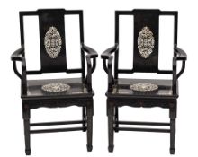 A pair of Chinese black lacquer and mother of pearl inlaid open armchairs:,