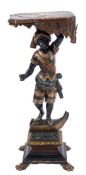 A Continental carved wood and decorated Blackamoor figure:,