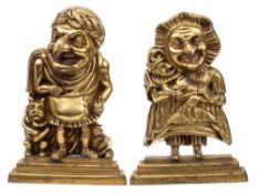 A pair of brass door stops of Punch and Judy: Mr Punch dressed as a Roman emperor,