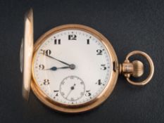 A gentleman's 9ct gold half hunter pocket watch: the white enamelled dial with Arabic numerals and