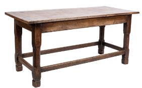 An oak refectory table:, with a cleated plank top on square section and chamfered legs,