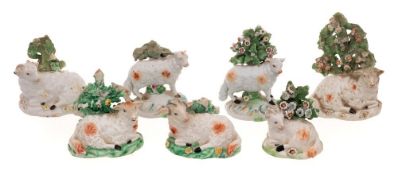 A group of seven Derby porcelain models of sheep: including a pair,