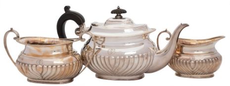 An Edwardian matched silver three-piece batchelor's tea service maker Harrison Brothers & Howson,