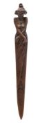 An Art Nouveau period bronze paper knife: in the form of a semi nude female draped in robes,