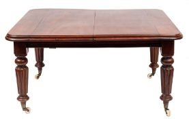 A Victorian mahogany extending dining table:, with a telescopic action,